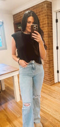 black sleeveless sweater with bow